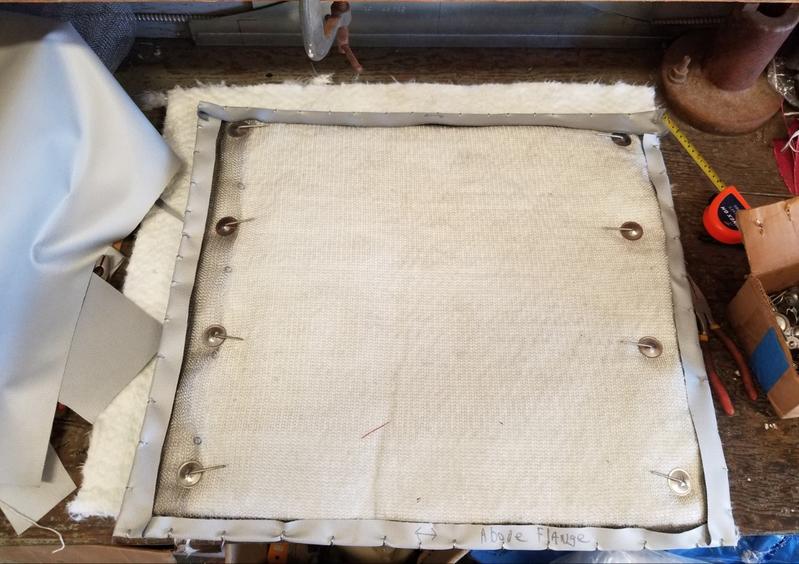 The inside of a premade insulation blanket for a marine exhaust. The pliers had no problem with multiple layers of the silicone cloth or the wire mesh.