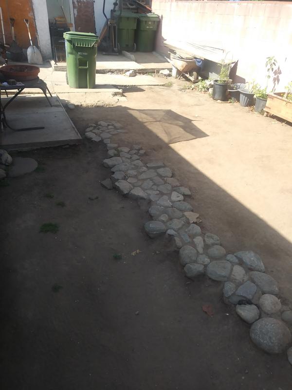 Use my new Laser pointer to measure this backyard for new concrete patio