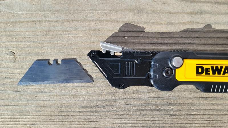 Spring-loaded blade-release (ignore the pebble used to hold it open)