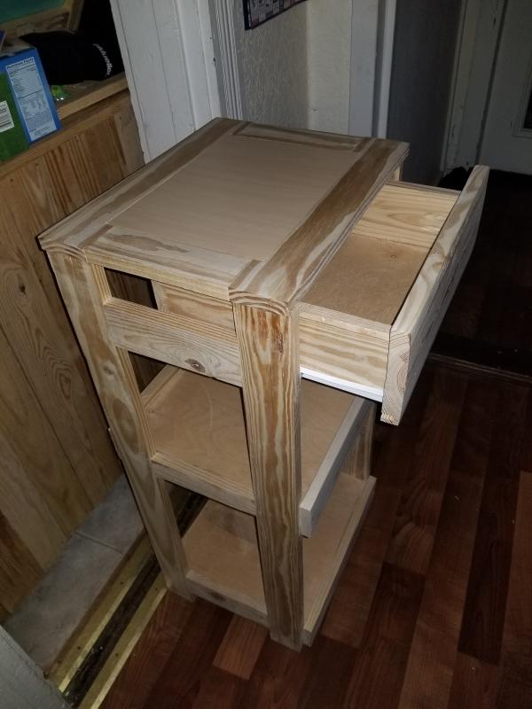 A telephone stand created from reclaimed wood and a sheet of 1/4 ply. The pocket holes and screws were all set using the cordless drill. The plywood inlaid top was set using DW6184 router.