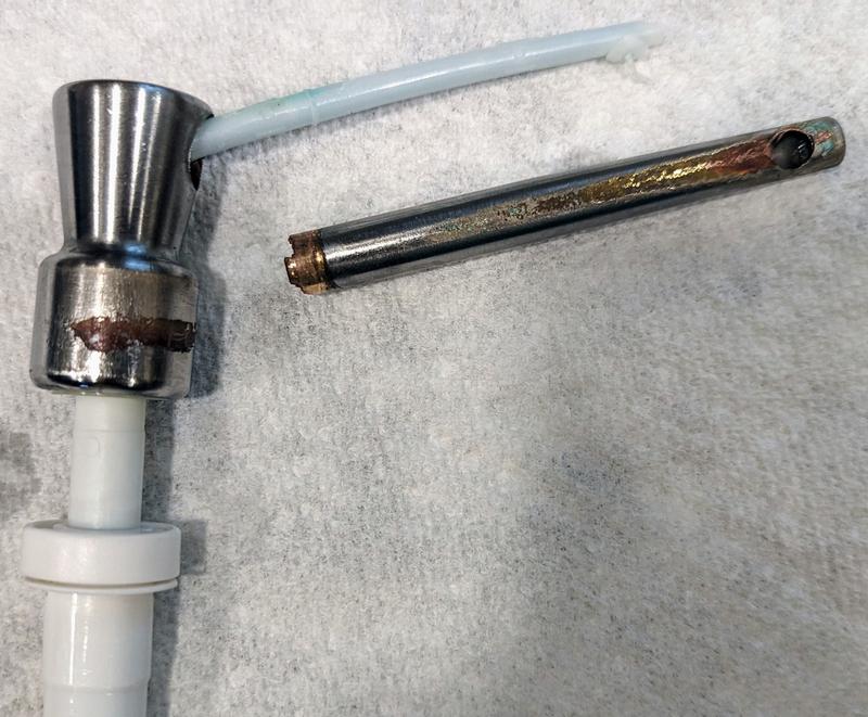 Rusted and broken Delta soap pump