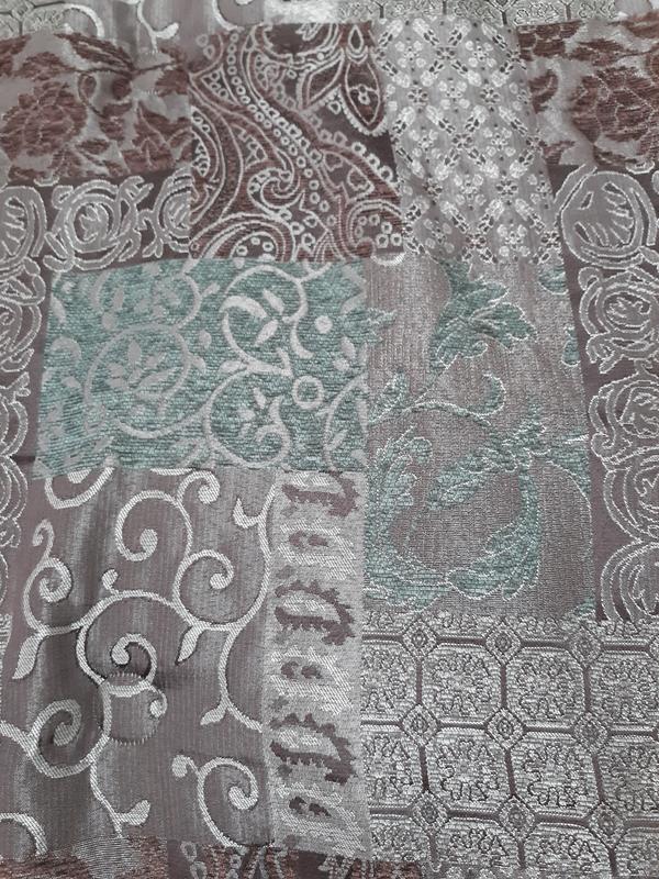 Here is the Galleria for peace Brown comforter set showing a close up of the impressive combination and the motifs woven and Chenille  metallic Yarns