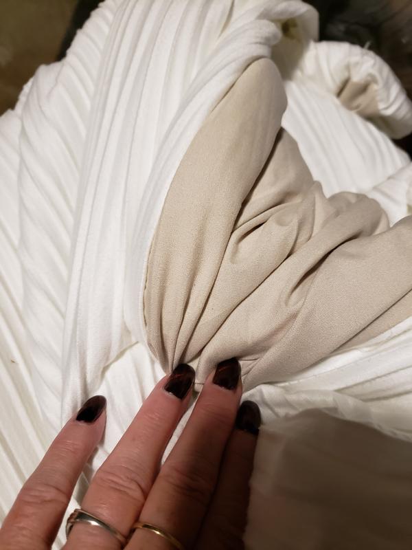 Light gray and looks tan underneath