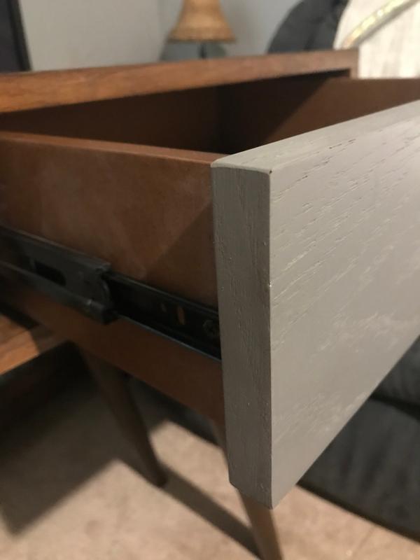Close up of the gray color and open drawer.
