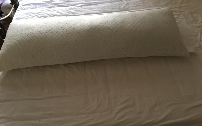 Pillow measures approx. 52”L x 16” W