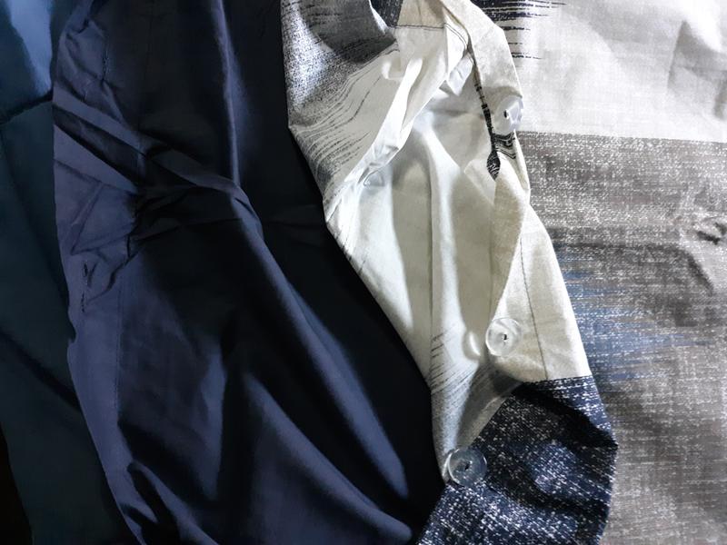 Here is the Alpine three piece duvet cover mini set full / Queen Navy showing the opening of where the blanket would go in and the buttons