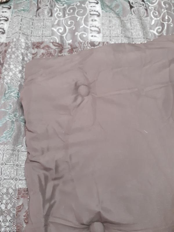 Here is the Galleria for a piece Brown comforter set close up showing the turfing button light throughout the comforter set and how far apart they are