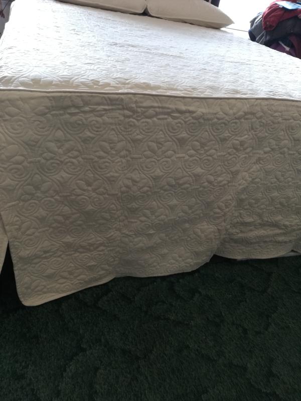 This bedspread is on a queen size platform bed.