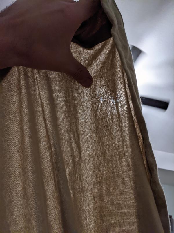Sheet held up to a ceiling light