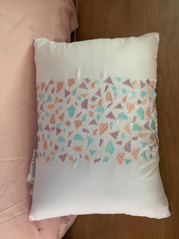 The embroidered decorative pillow