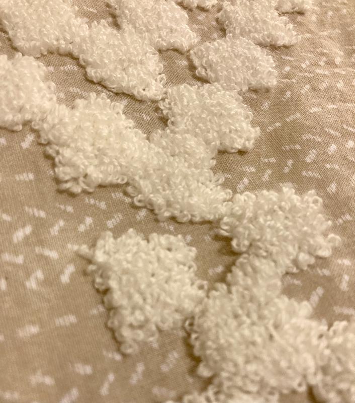 Close up showing the background pattern and the high chenille