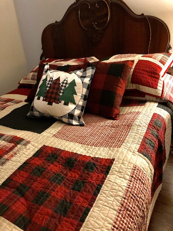 Quilt has dark navy blue and red coloring. Pairing buffalo checked pillows with black looked fine.
