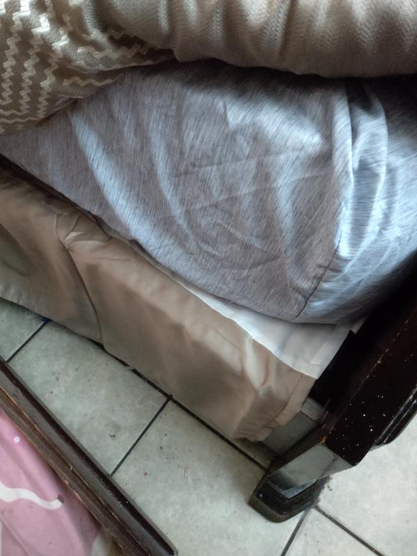 The bed skirt is between the mattress and the box spring