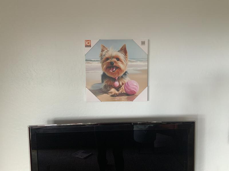 On the wall hanging.