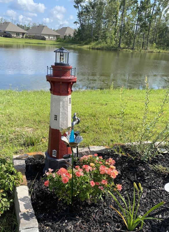 Solar lighthouse garden deals statue