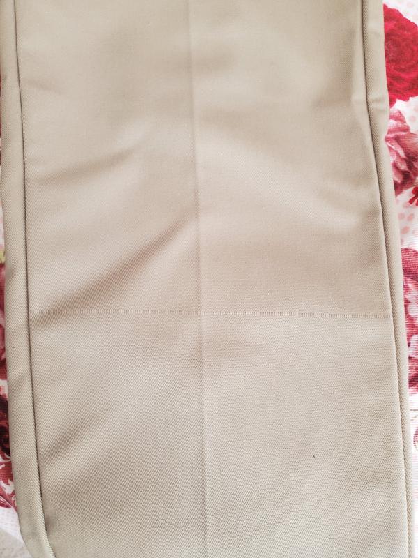 Horizontal splicing of fabric on left pant leg