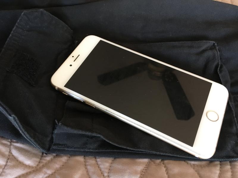 Iphone 6 plus fits in cargo pocket and close if you place like this