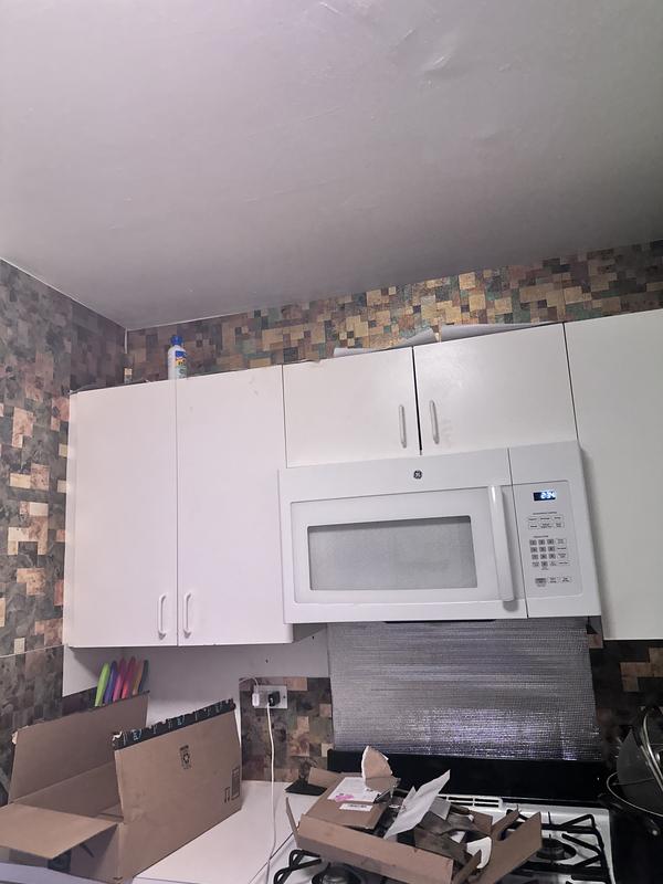 Putting up new wall tiles which had to be cut at certain areas like the corners