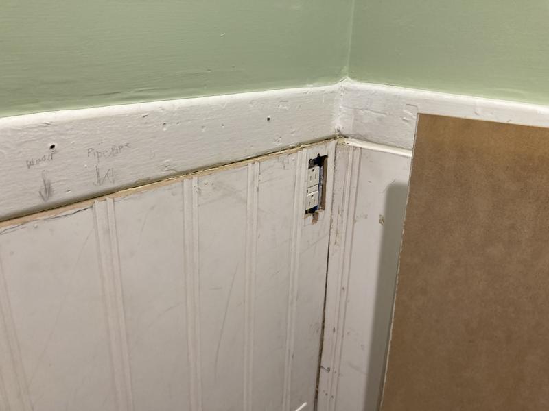 Cut panel and opening for electrical outlet