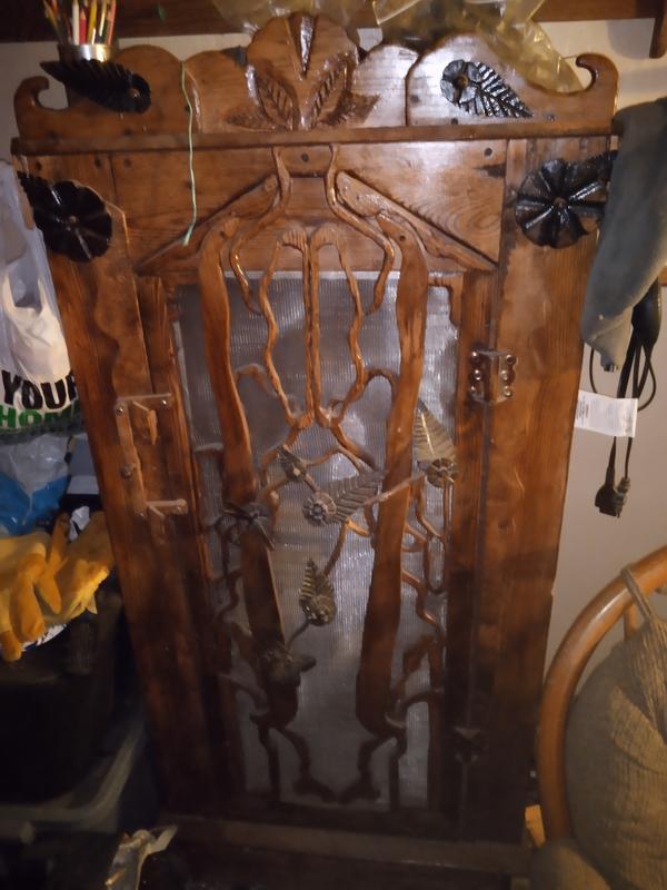My custom gun cabinet with Dremel carved ornamentatiom