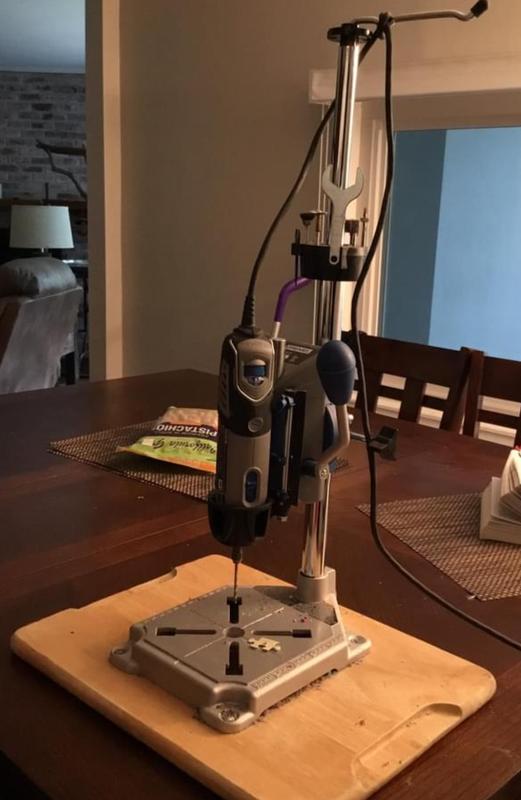 Dremel with press and tool accessories