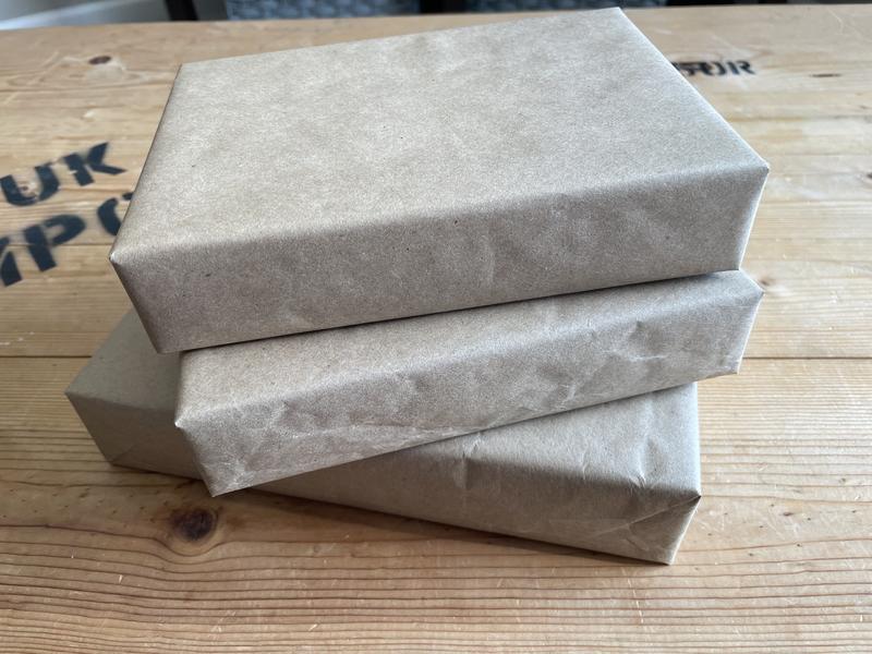 Christmas gifts wrapped in Kraft paper and ready to be decorated!