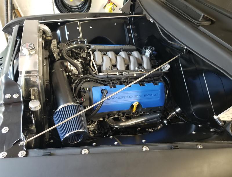 Engine bay, some Duplicolor flat black contrast to the DAP1698 on the body