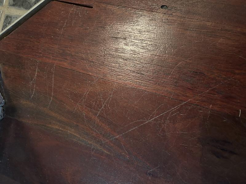My newly scratched floor. Also the battery is useless