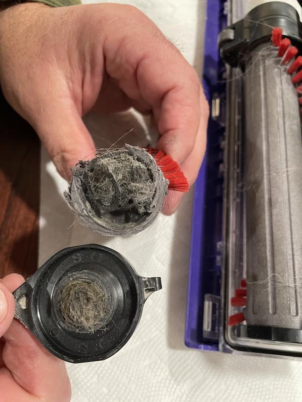 Broken piece with hair stuck around it.