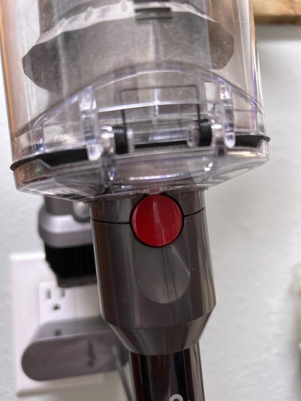 This button extremely difficult to disengage from the canister