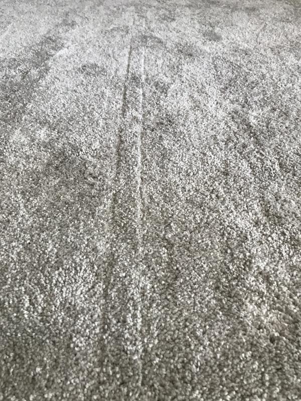 Track in carpet left down center of path