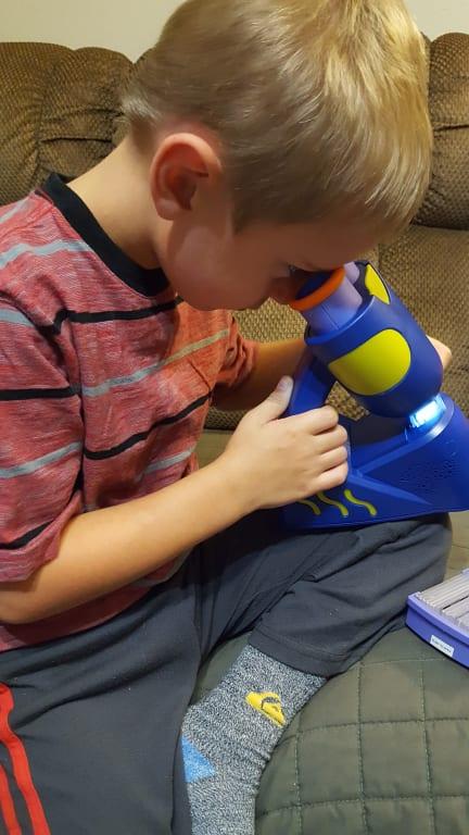 Learning about his world with GeoSafari Microscope