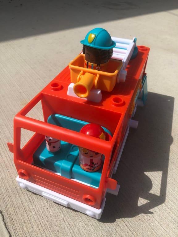 Fire fighters riding in the truck