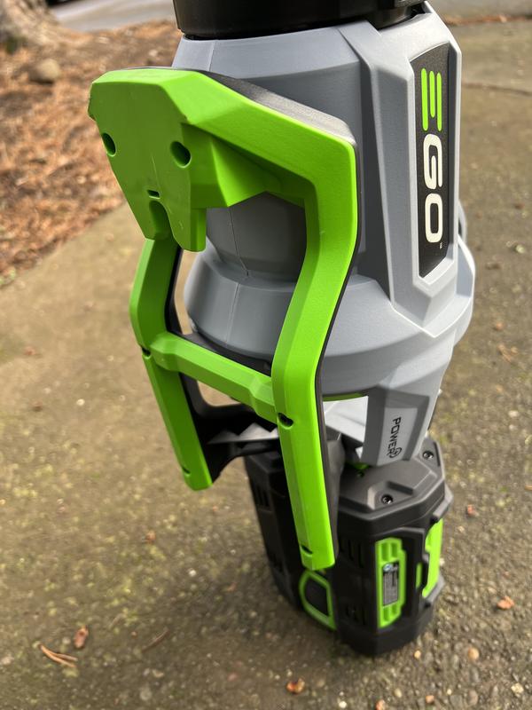 Photo 1 blowing pine needles.  Photo 2, a side by side comparison of an eighteen volt blower compared to the EGO.   Photo 3, there is a hook for hanging the blower on the wall.