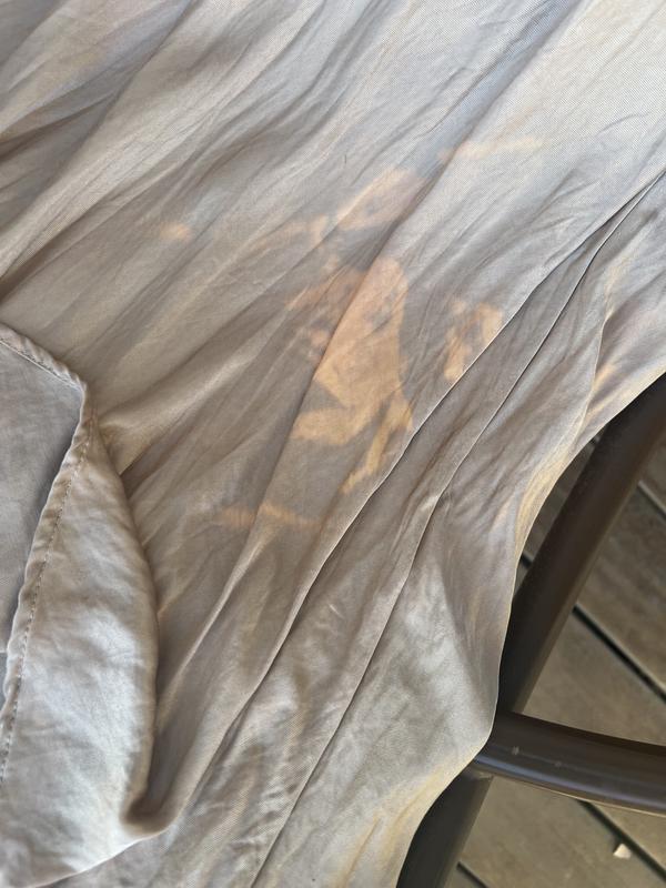 Customer photo for "Leaves a bleach stain on clothes!"