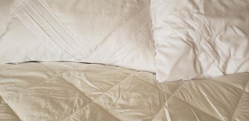 White pillow and snow white blanket