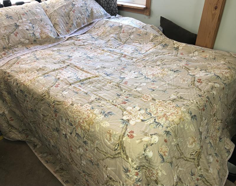 Full Size bed.  None hanging over the back side.