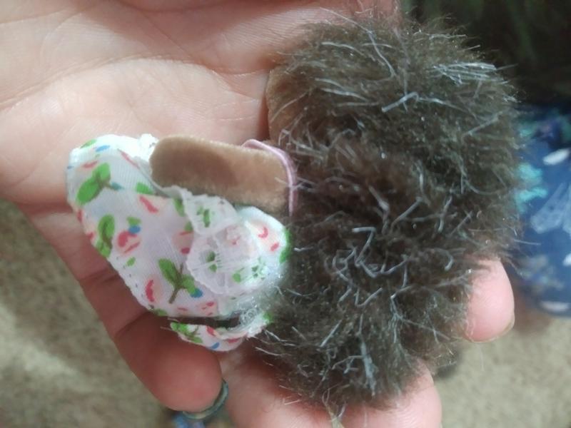 Dress strap goes under hair