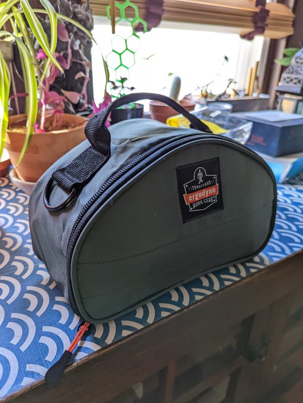 Zipped up with respirator and cartridges attached