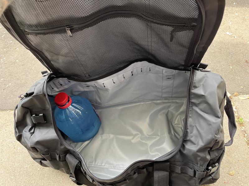 That’s a gallon water jug. Looks small inside this amazing duffel
