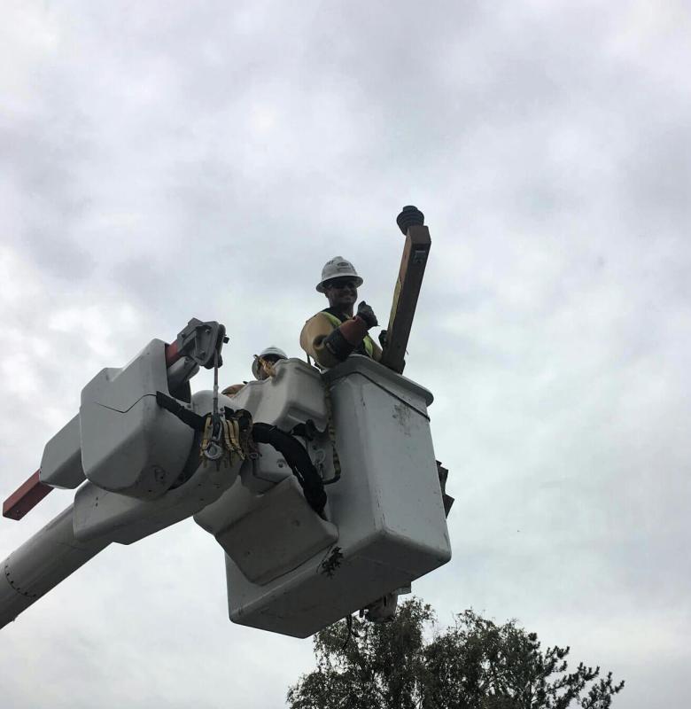 Hanging a cross arm out of the bucket truck.
