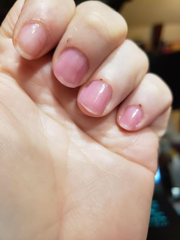 Natural nail with Essie base  on index finger.  Three coats of Mall Crawler on the others