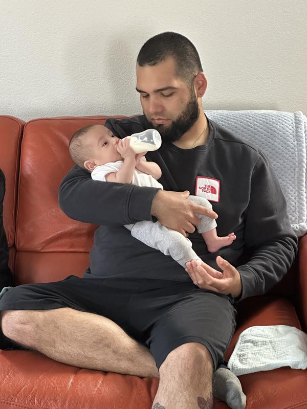 3 month old holding evenflo bottle