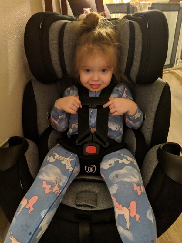 Testing out the car seat before it was installed.