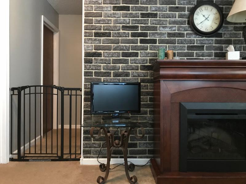 Gate separating kitchen from hallway