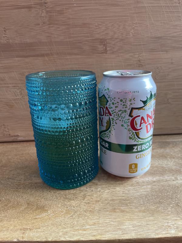 Fits one can of soda, full to brim, with no ice.