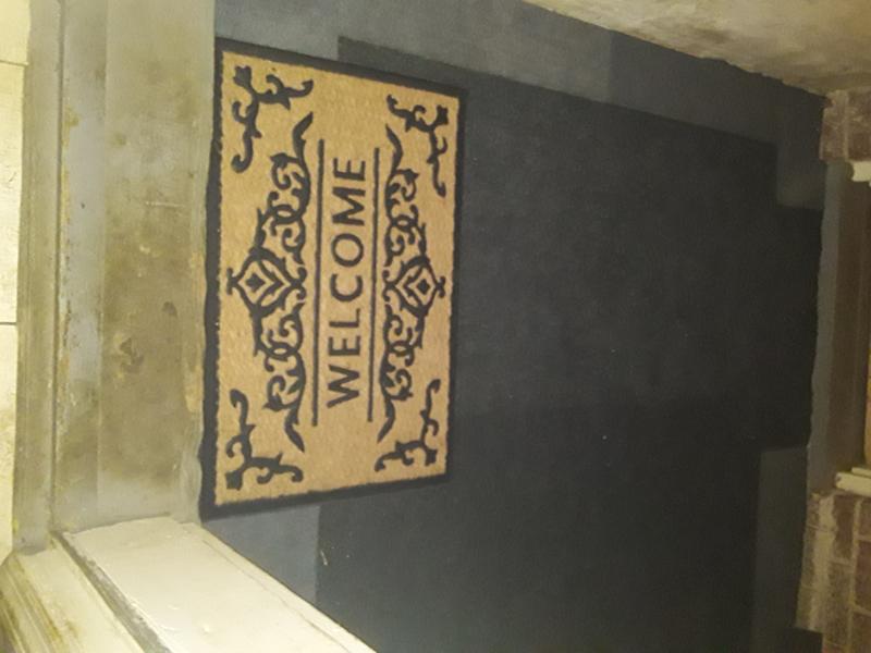 Entry way, notice the edging the "Peel and Stick First Impressions" didn't matter which way the tiles laid, as with the cheaper brand..