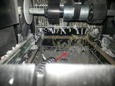 Bar that the shredded paper gets stuck on