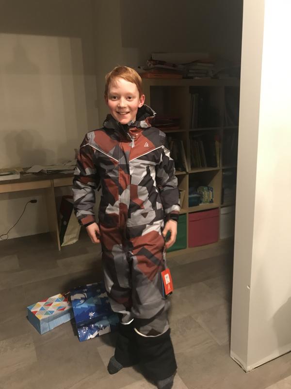 He is 11. The Medium fits him well with a bit of room to grow.