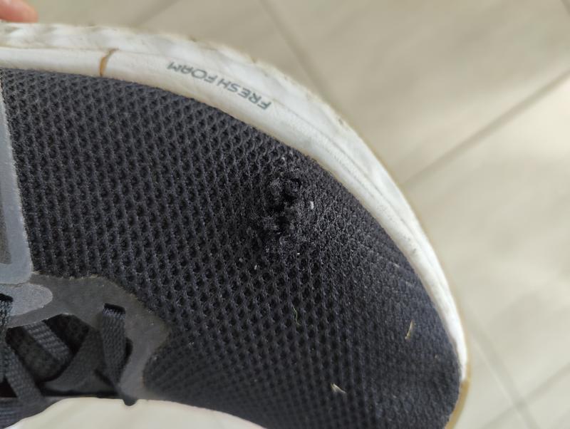 Torn mesh on the left foot